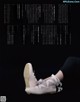 A pair of ballet shoes sitting on top of a black surface.