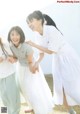 A group of young women standing next to each other on a field.